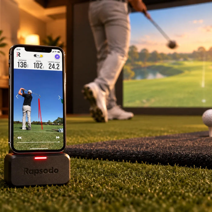 Rapsodo launch monitor on a hitting mat in a home golf simulator